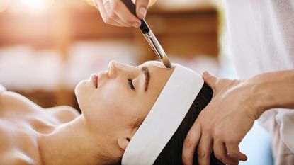 woman getting a chemical peel for acne scars