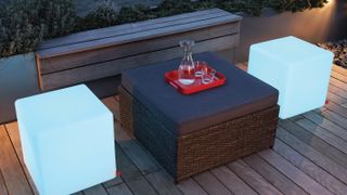 deck at night with illuminated seats and built in bench