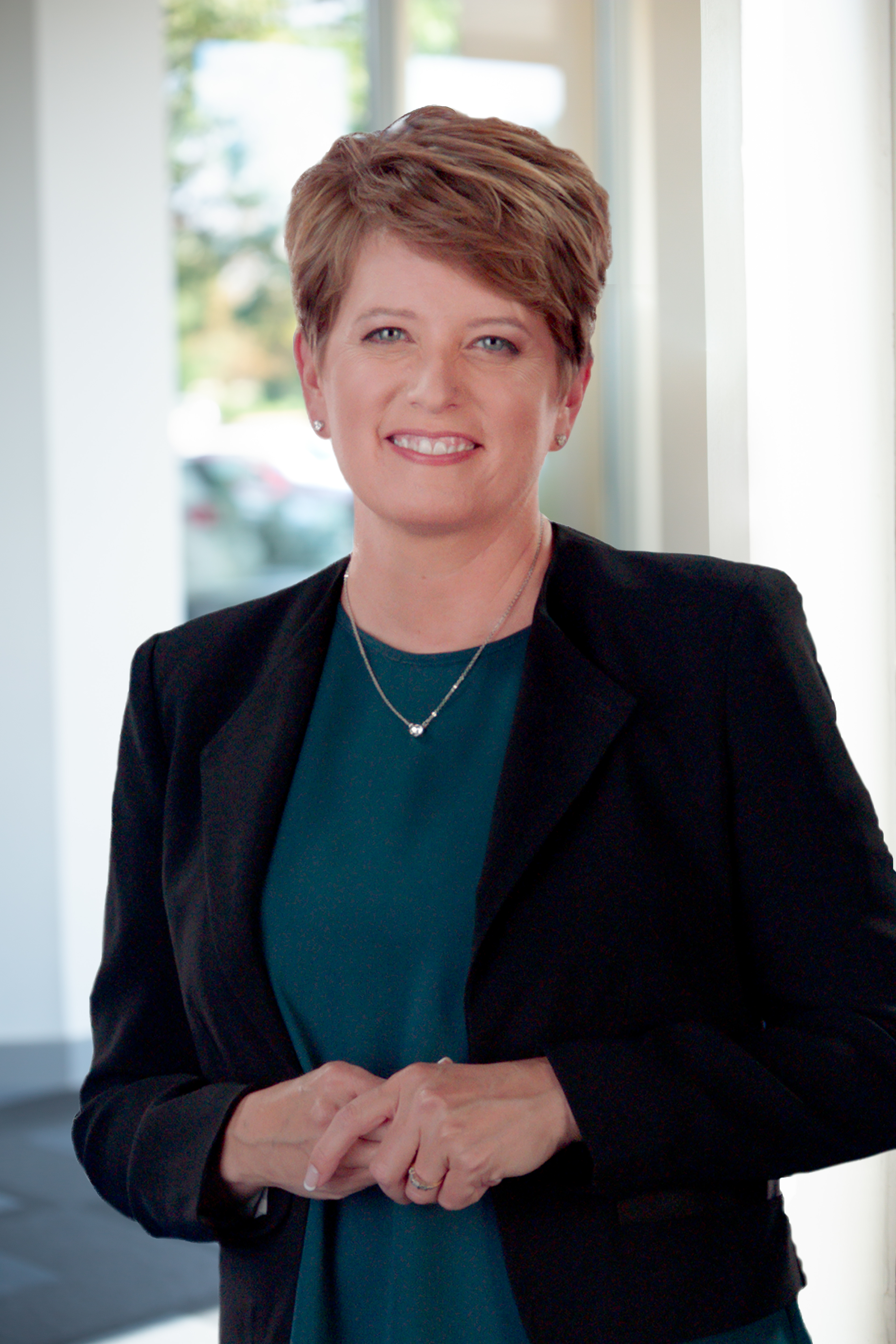 Angi Hicks, woman wearing blue top and black jacket