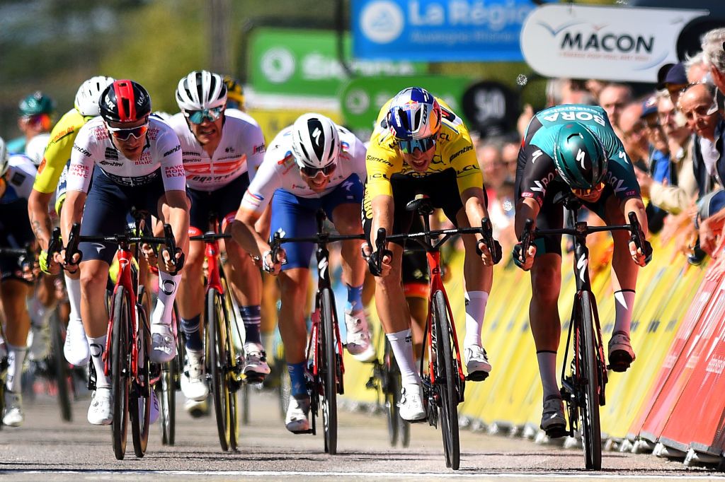 CHAINTRE FRANCE JUNE 09 LR Ethan Hayter of United Kingdom and Team INEOS Grenadiers White Best Young Rider Jersey Wout Van Aert of Belgium and Team Jumbo Visma Yellow Leader Jersey and Jordi Meeus of Belgium and Team Bora Hansgrohe sprint to win during the 74th Criterium du Dauphine 2022 Stage 5 a 1623km stage from ThizylesBourgs to Chaintr WorldTour Dauphin on June 09 2022 in Chaintre France Photo by Dario BelingheriGetty Images