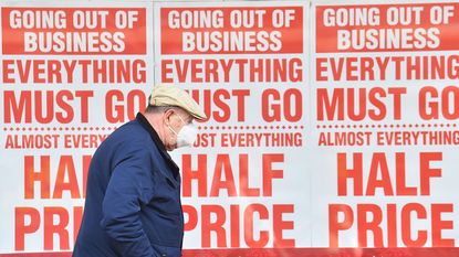 Shop window saying 'going out of business' 