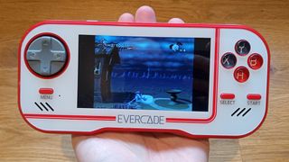 A photo of an Evercade console in the palm of a hand