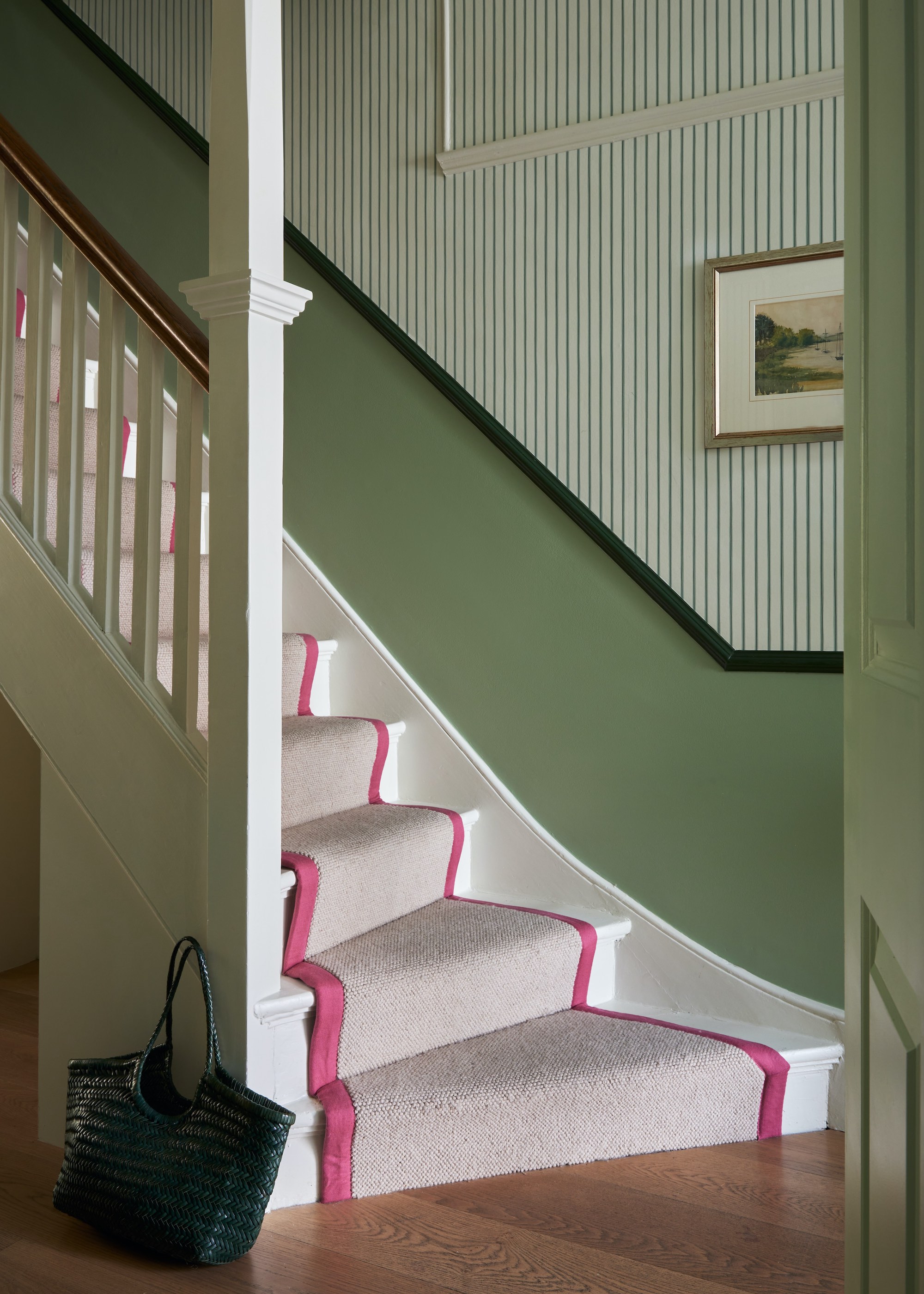 white staircase with runner with plan centre and pink trim