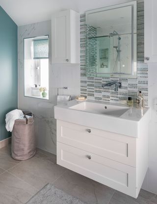 wall tiles on bathroom with teal wall and washbasin