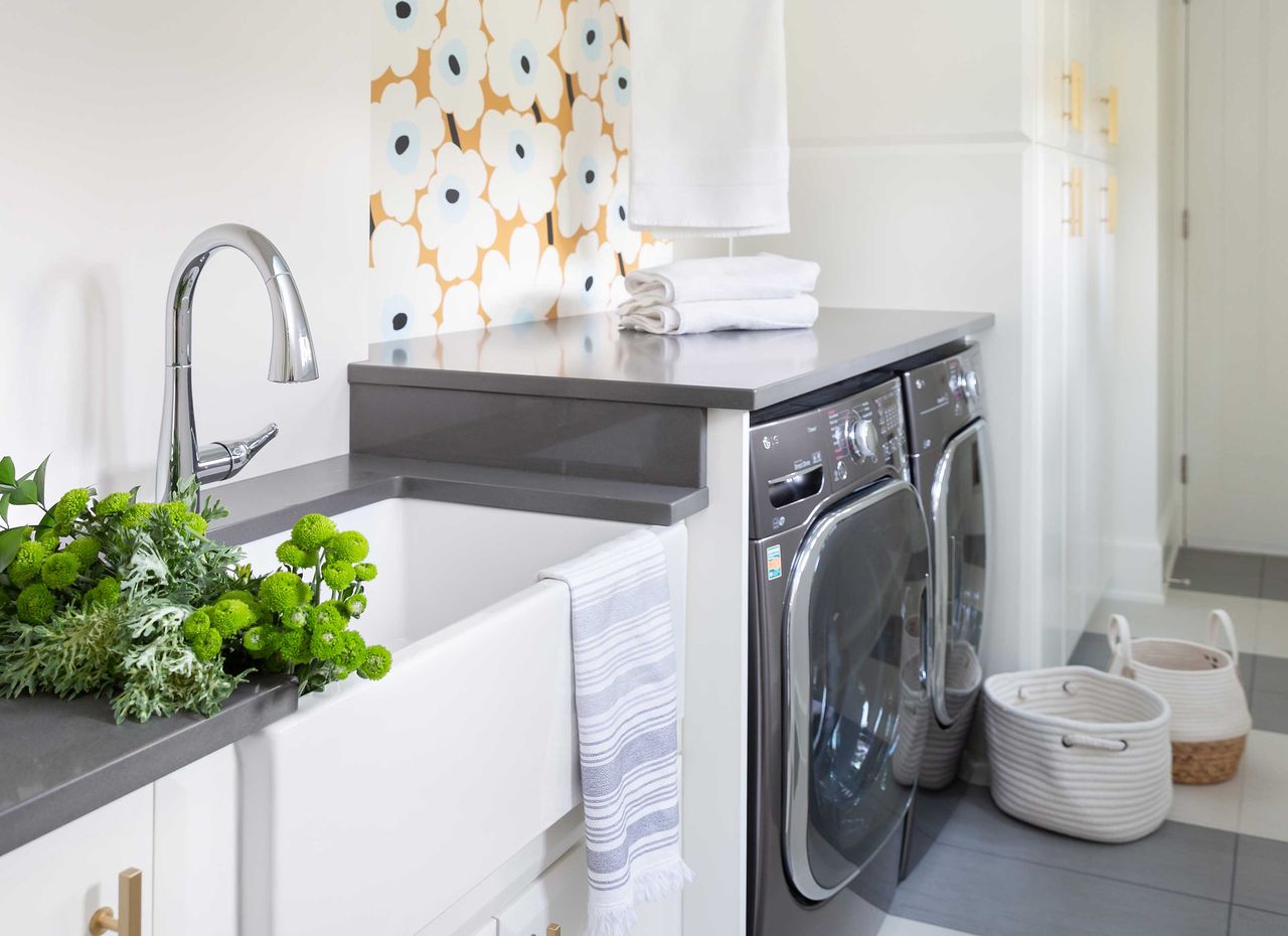 a laundry room with wallpaper