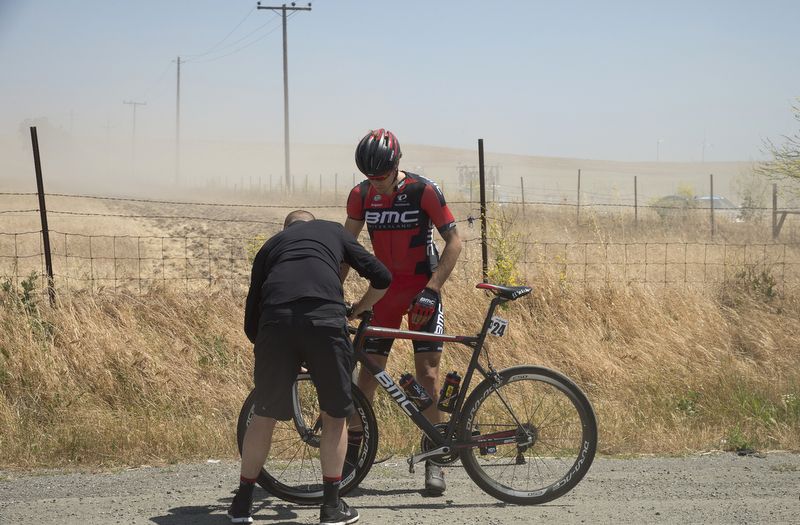 Daniel Oss (BMC) gets a front wheel change