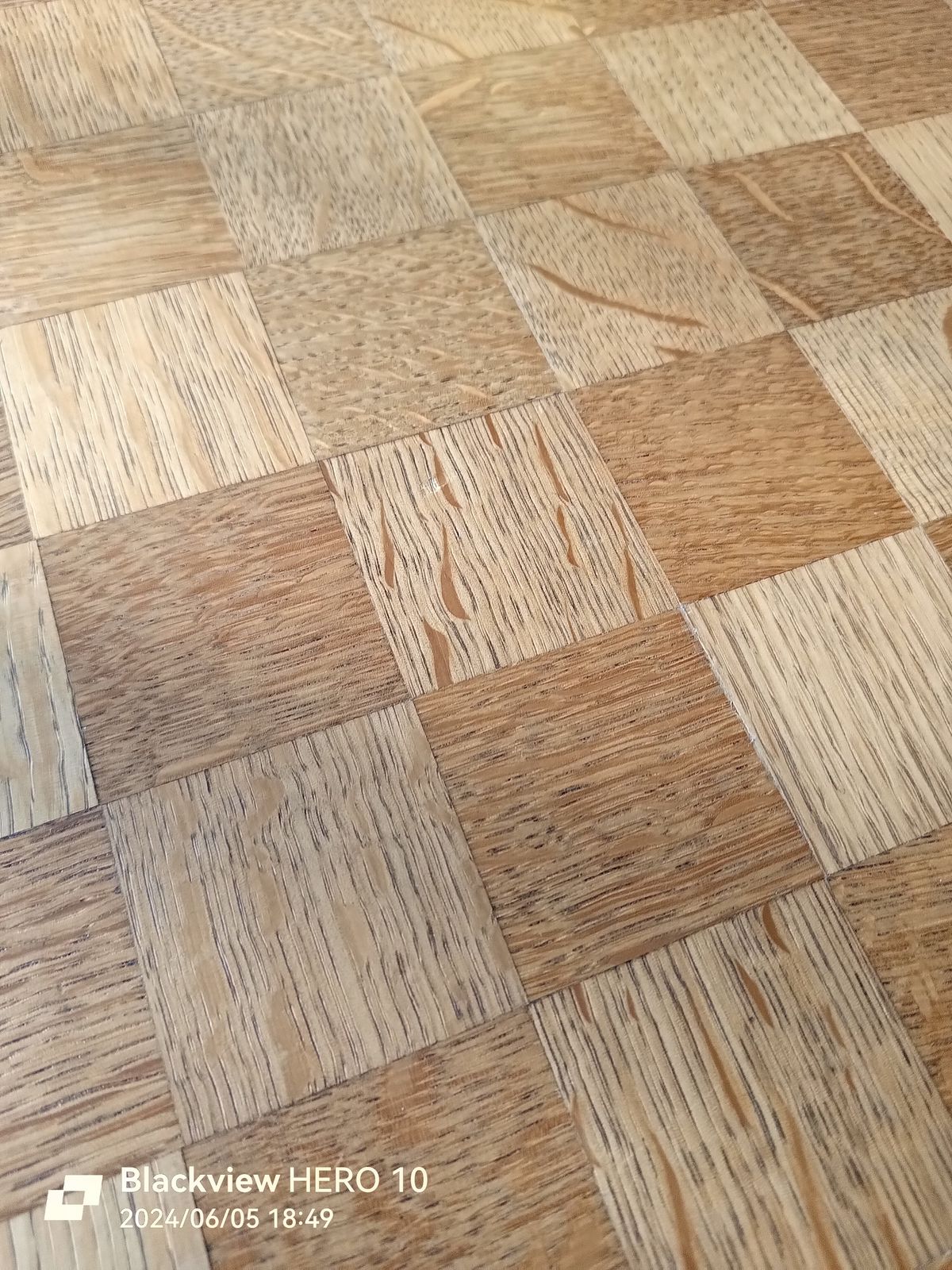 A close up picture of a wooden table top