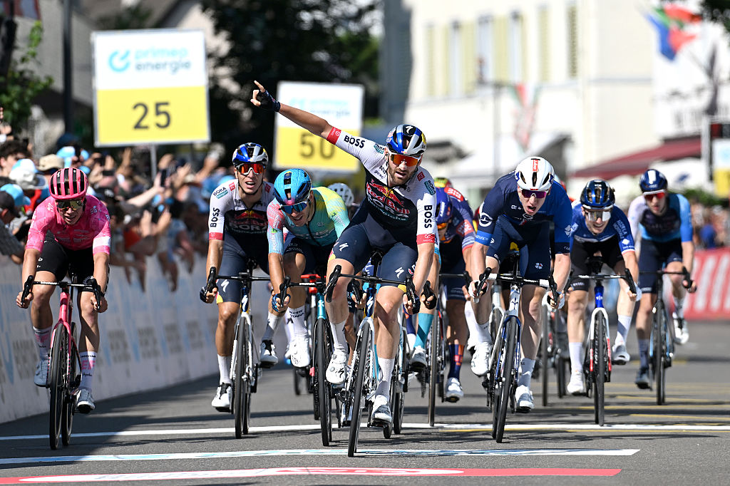 NEUHAUSEN AM RHEINFALL, SWITZERLAND - JUNE 20: Jordi Meeus of Belgium and Team Red Bull - BORA - hansgrohe celebrates at finish line as stage winner ahead of (L-R) Madis Mihkels of Estonia and Team EF Education - EasyPost, Davide Ballerini of Italy and Team XDS Astana and Lewis Askey of Great Britain and Team Groupama - FDJ during the 88th Tour de Suisse 2025, Stage 6 a 186.7km stage from Chur to Neuhausen am Rheinfall / #UCIWT / on June 20, 2025 in Neuhausen am Rheinfall, Switzerland. (Photo by Tim de Waele/Getty Images)