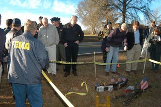 FEMA official surveys shuttle debris along with the Columbia Accident Investigation Board near Nacogdoches, Texas.