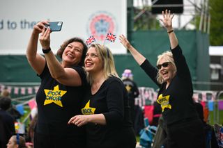 People take selfies at The Big Lunch at The Long Walk, during the Coronation of King Charles III and Queen Camilla on May 07, 2023 in Windsor, England