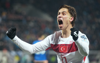 Kenan Yildiz of Turkiye celebrates his team's first goal scored by teammate Kerem Aktuerkoglu (not pictured) during the FIFA World Cup 2026 European Qualifiers match between Kosovo and T&uuml;rkiye