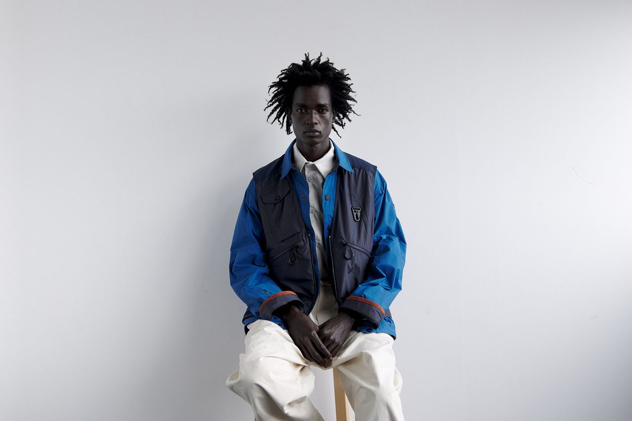 Utilitarian and Workwear-inspired S/S 2024 Men’s Fashion photographed against white wall