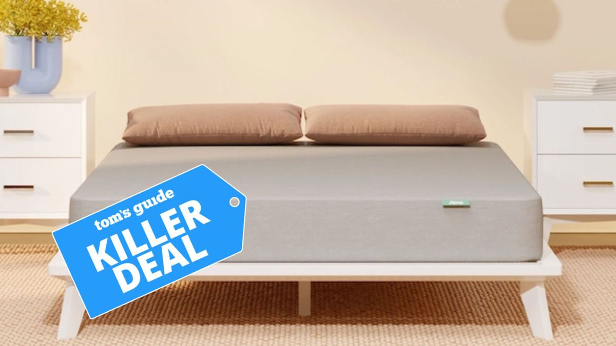 The image shows the Siena Essential Memory Foam Mattress on a white bed frame with a Tom&#039;s Guide &#039;killer deal&#039; badge overlaid on top