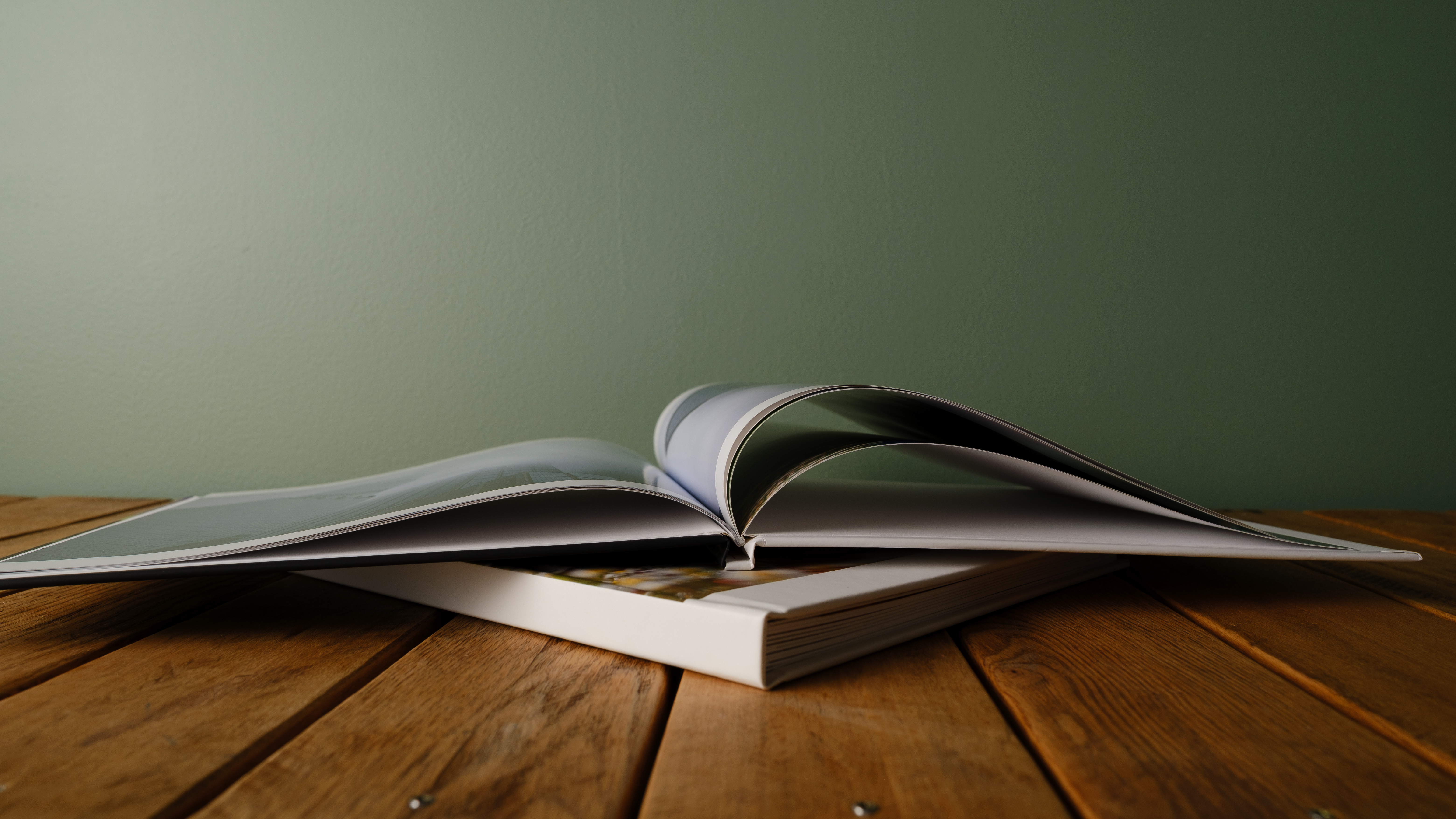 Mixbook photo books on a desk