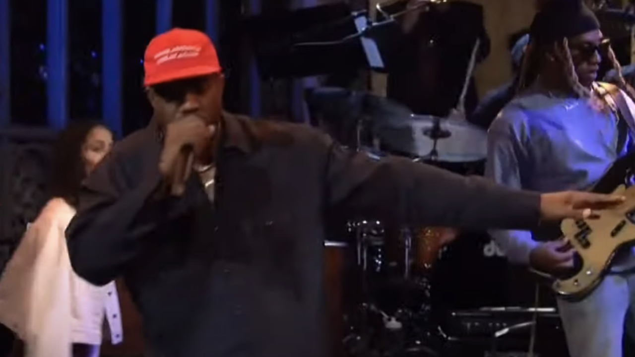 Kanye West performing with his MAGA hat on Saturday Night Live