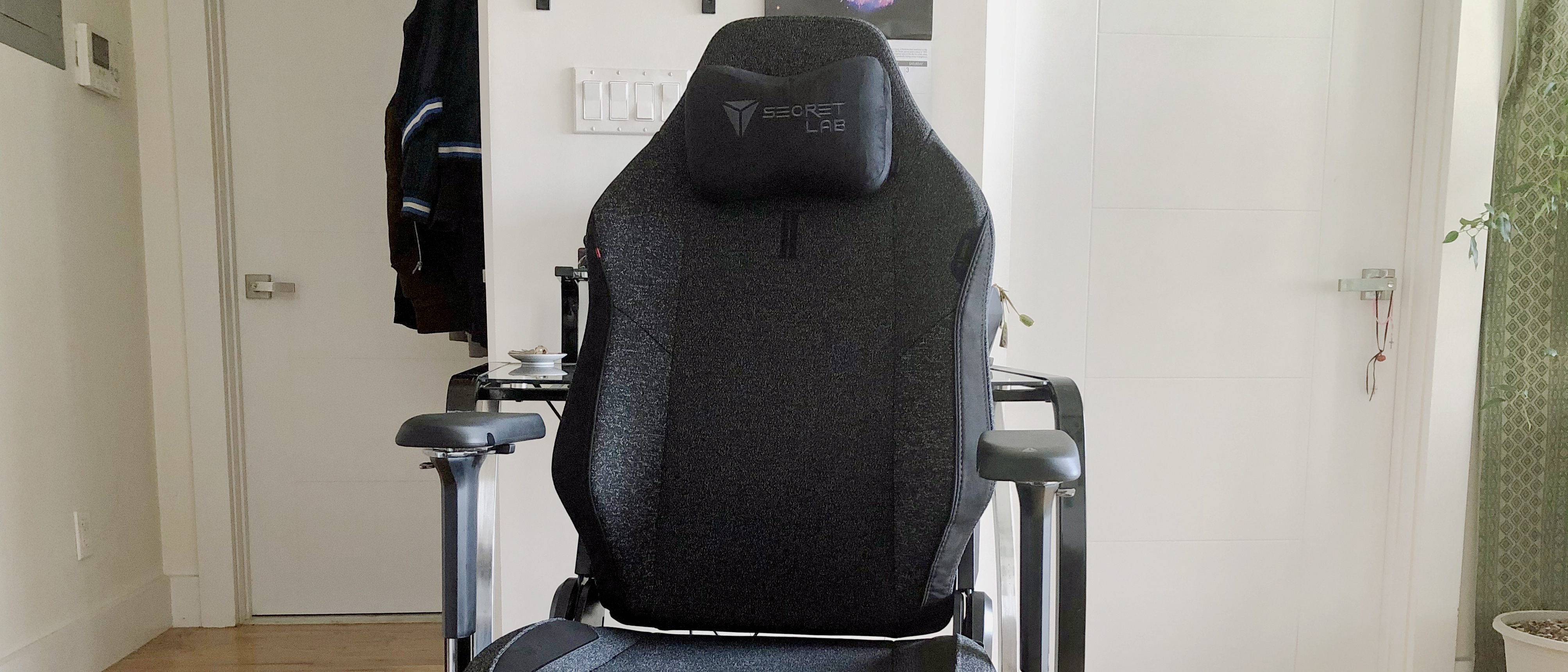 gray secretlab gaming chair in front of white wall