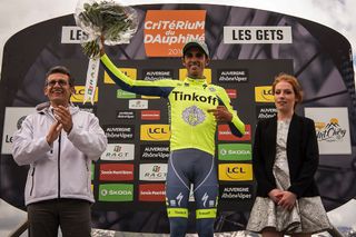 Alberto Contador celebrates on the podium after the Criterium du Dauphine prologue.
