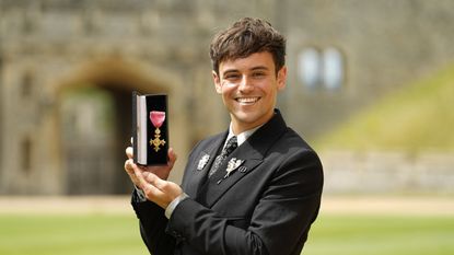 Tom Daley beamed as he receives incredible honor from Prince Charles