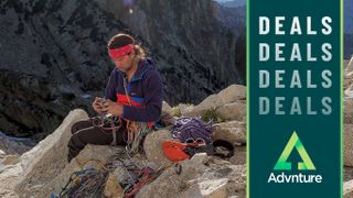 Climber wearing Patagonia fleece sitting on rock