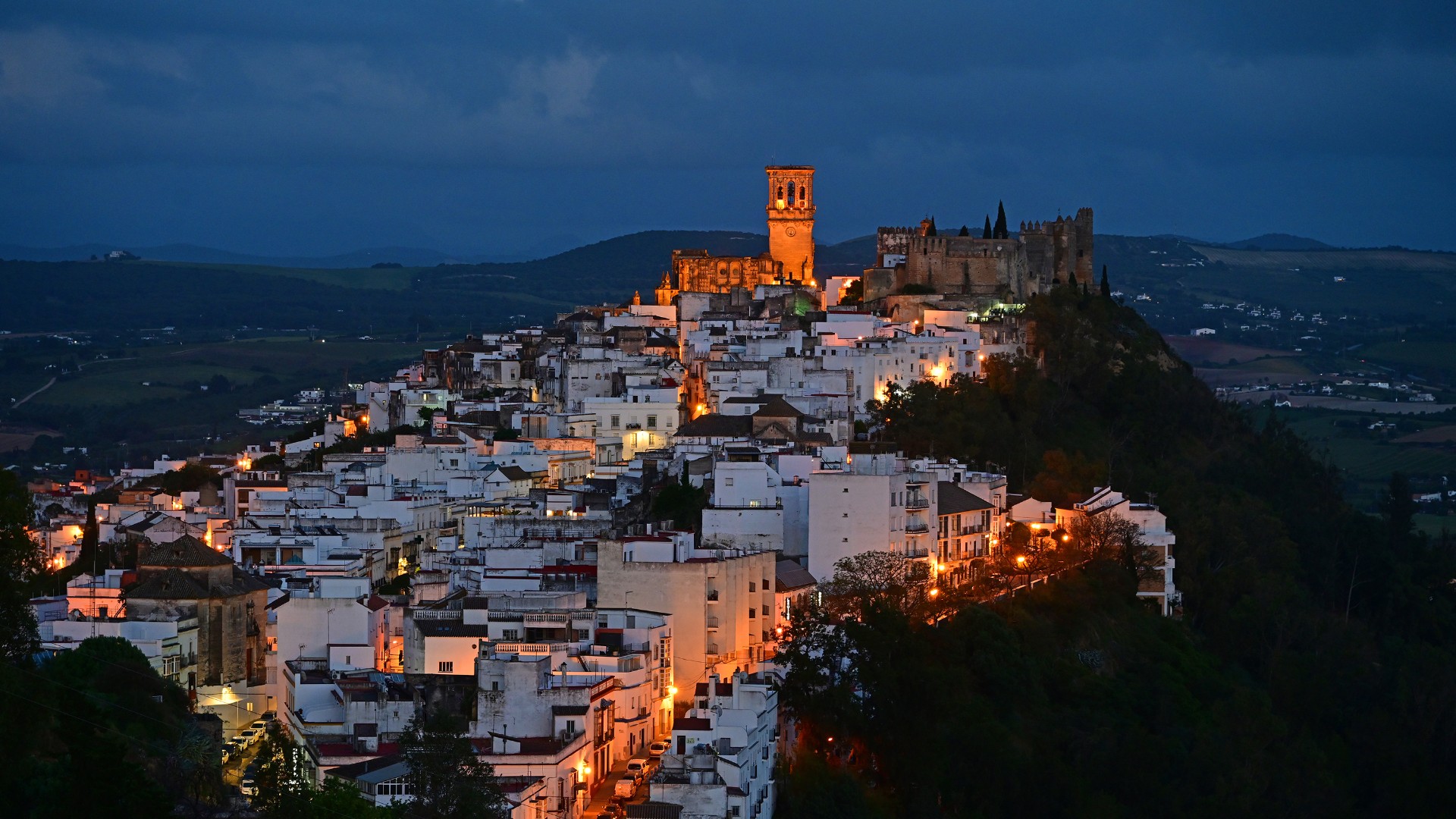 High angle view of illuminated buildings in a city at night.