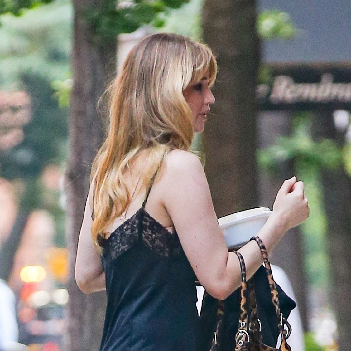 Jennifer Lawrence wearing a lace-trimmed black dress in NYC