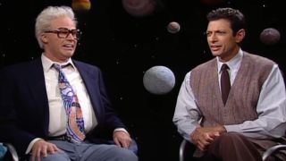 Will Ferrell sits next to a confused Jeff Goldblum on Saturday Night Live.