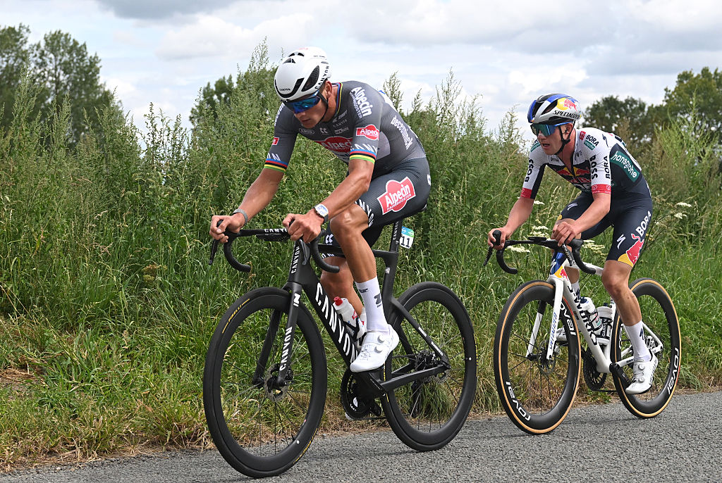 GERAARDSBERGEN, BELGIUM - AUGUST 22: (L-R) Mathieu Van Der Poel of Netherlands and Team Alpedin - Deceuninck and Maxim Van Gils of Belgium and Team Red Bull - BORA - hansgrohe compete in the chase group during the 20th Renewi Tour 2025, Stage 3 a 181.8km stage from Aalter to Geraardsbergen / #UCIWT / on August 22, 2025 in Geraardsbergen, Belgium. (Photo by Luc Claessen/Getty Images)