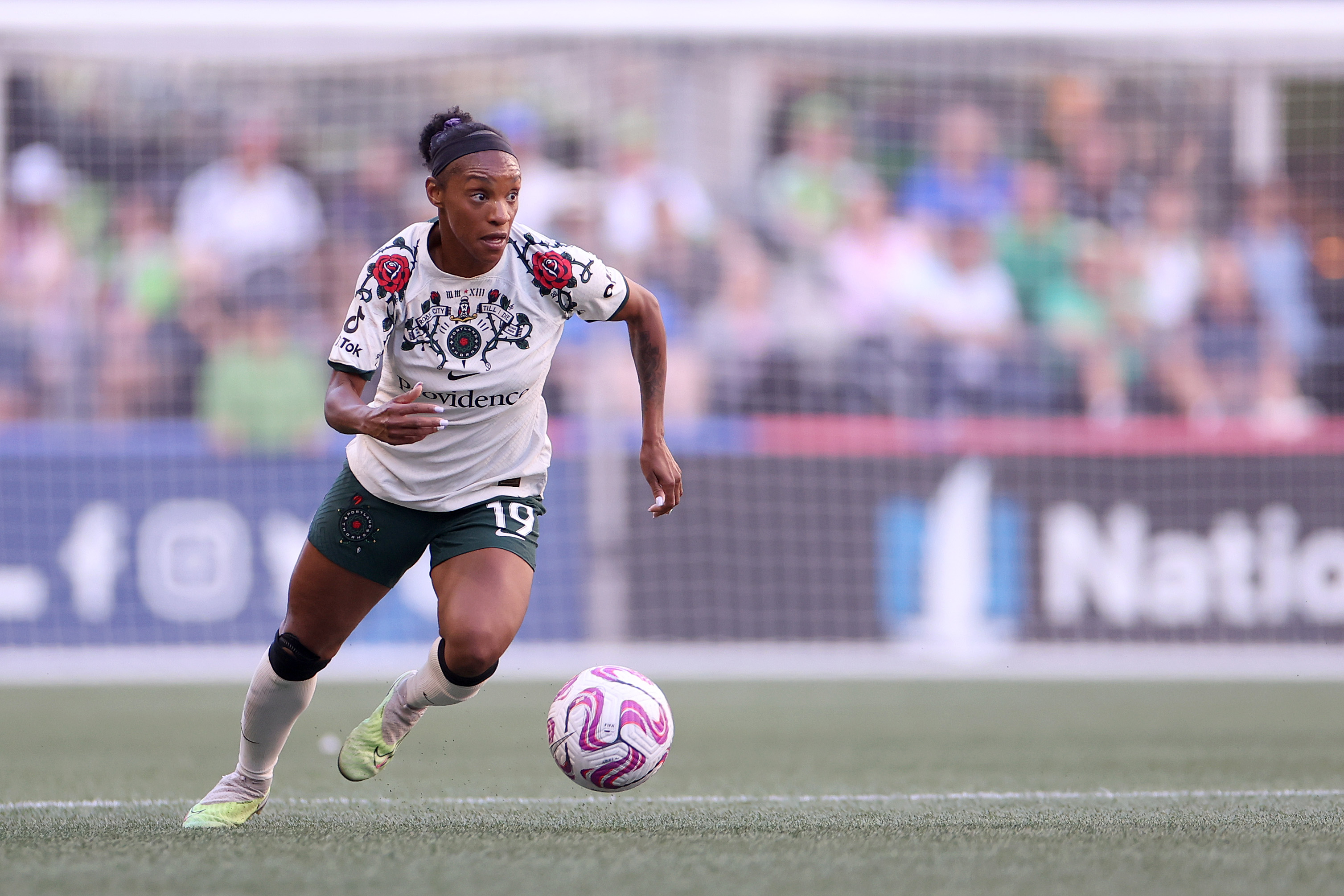 Crystal Dunn dribbling the ball