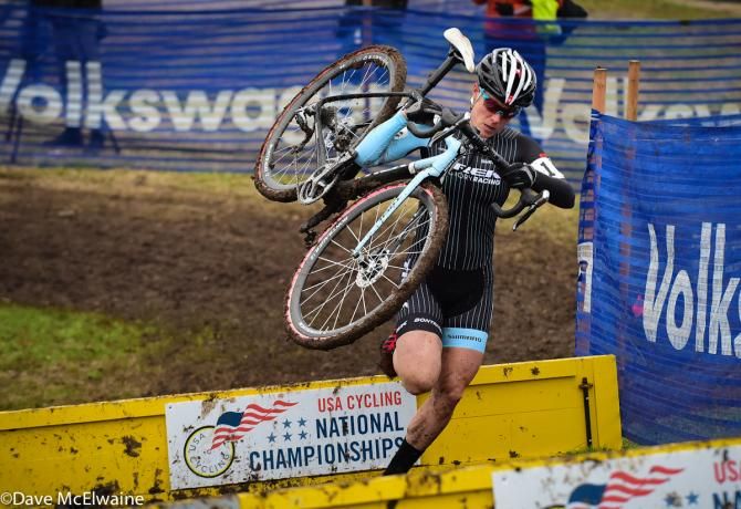 Katie Compton (Trek Factory Racing) running the barriers on lap two with over a 30 second lead