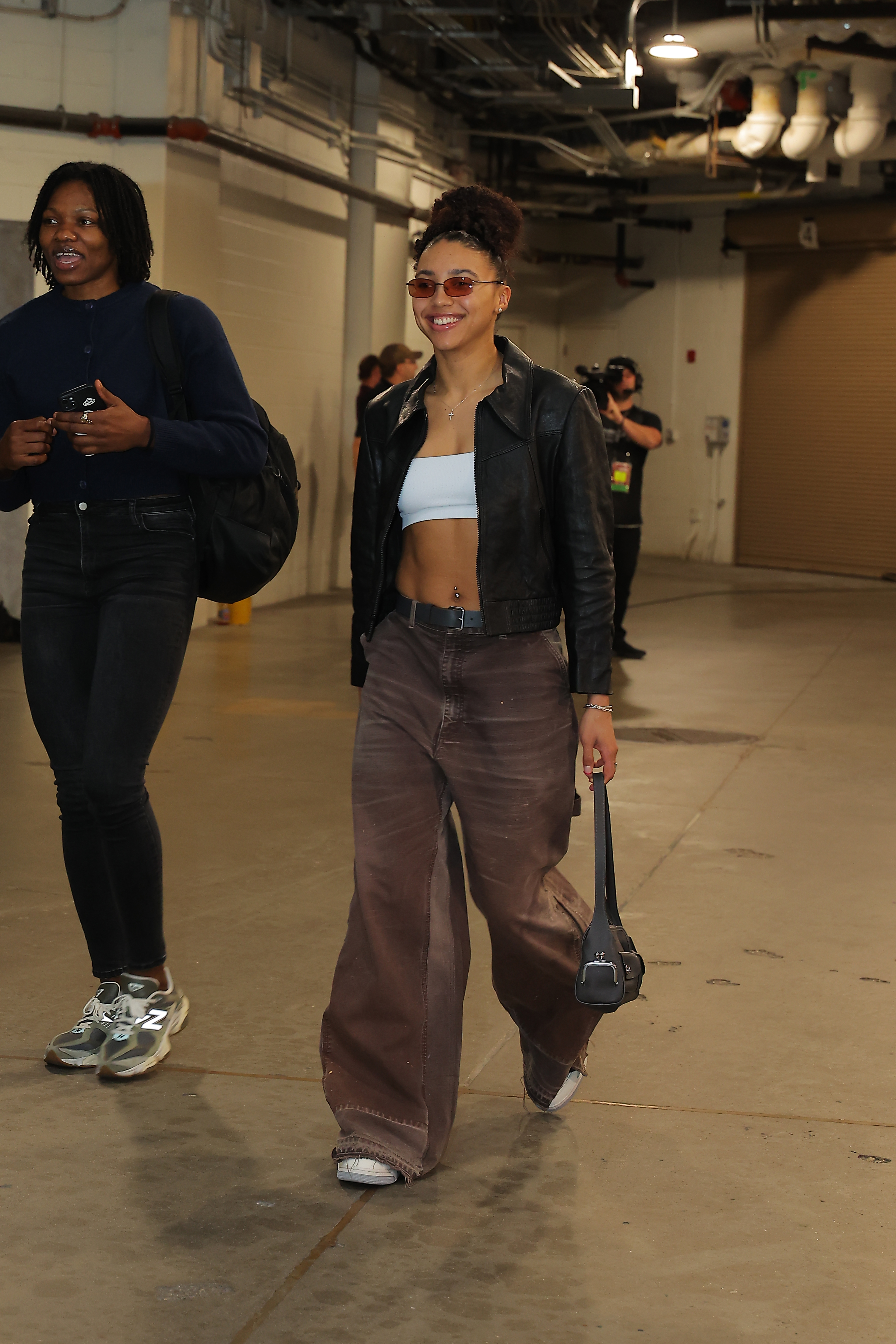 Azzi Fudd wore another tunnel outfit with a Coach bag on May 9