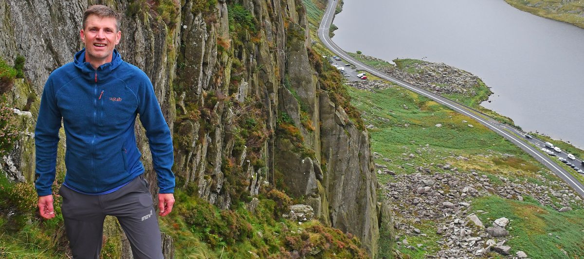 Man climbing in Rab Capacitor Hoody