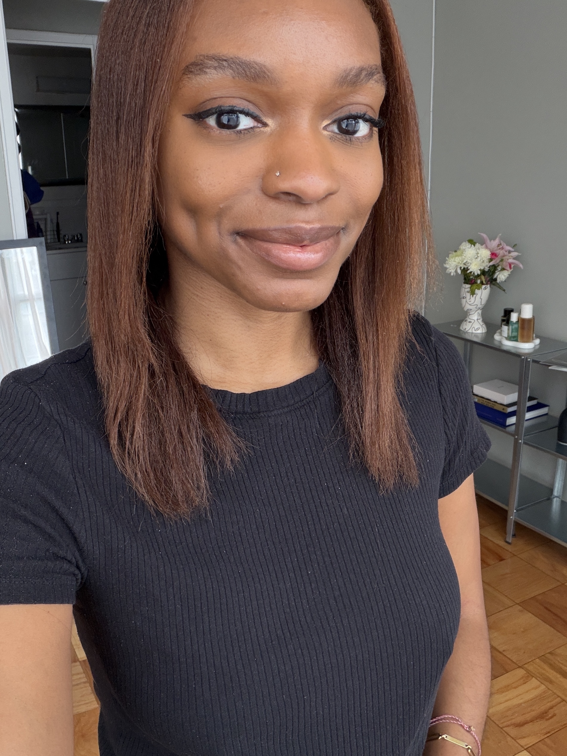 a selfie of a black woman with brown hair