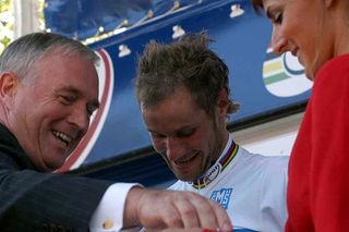 Pat McQuaid hands Tom Boonen his medal after winning the world road championships in Madrid this year