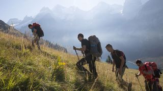best hiking backpacks: backpackers ascending