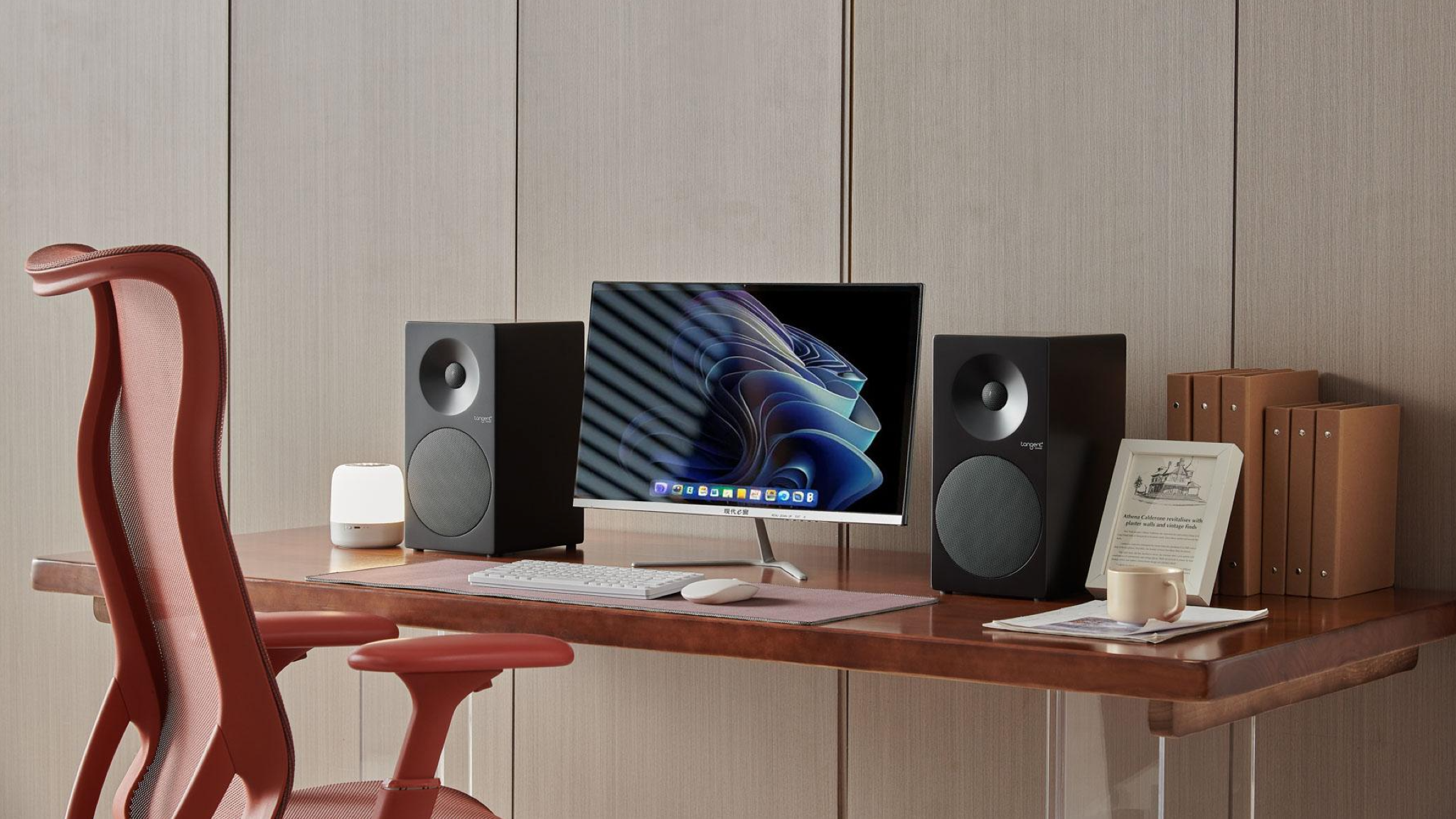 Tangent Spectrum II X4 bookshelf speakers on either side of a home computer, sitting on a nice modern-styled desk