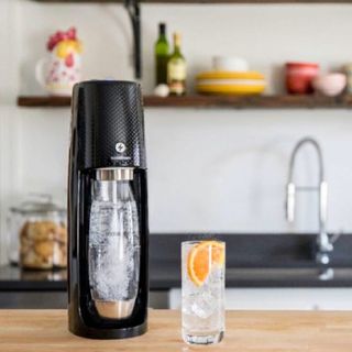 Soda Stream Genesis on a kitchen counter with a fresh drink
