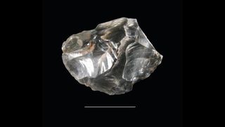 A fragment of transparent quartz crystal found at Neolithic burial site.
