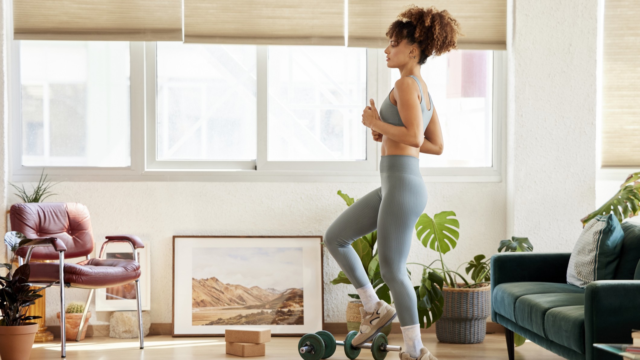 A woman works out in her home gym
