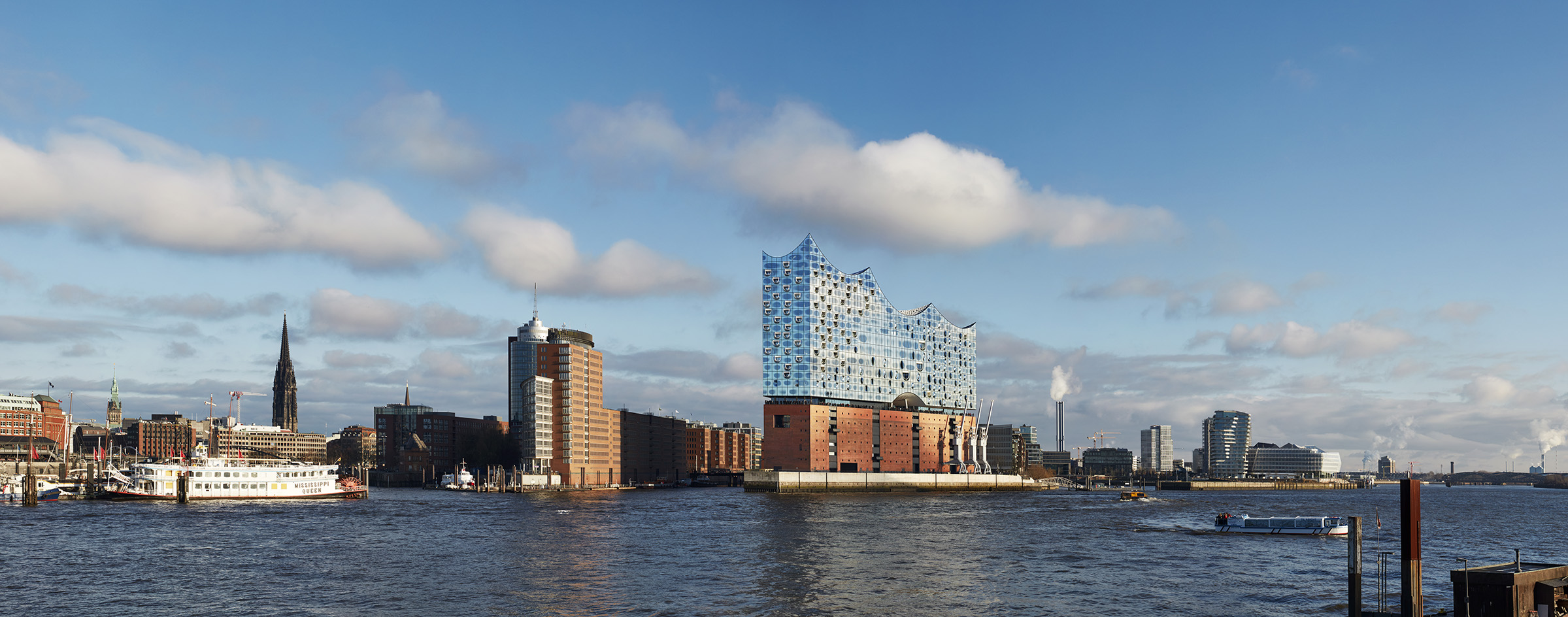 the Elbphilharmonie in Hamburg, by the water on a cloudy day