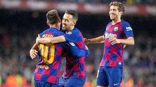 Lionel Messi, Sergio Busquets and Sergi Roberto celebrate a Barcelona goal against Celta Vigo in 2019.