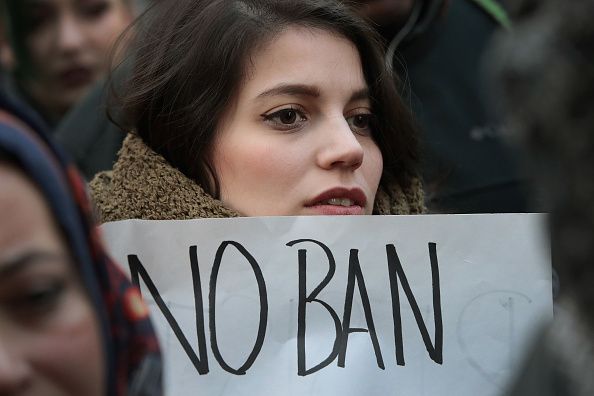 A protester opposed to Donald Trump&amp;#039;s travel ban.