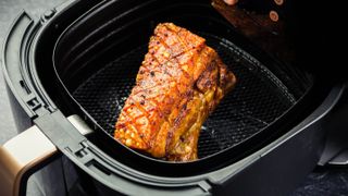 Pork belly in an air fryer basket