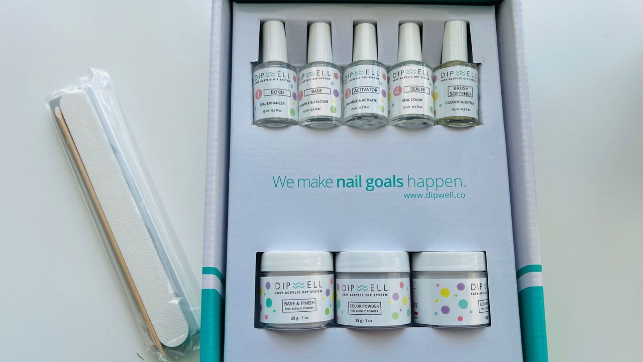 The DipWell BYOB on a white table for the best dip powder nail kits.