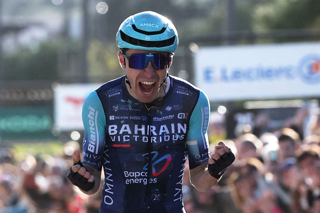 Bahrain - Victorious' French rider Lenny Martinez celebrates as he crosses the finish to win the 8th and final stage of the Paris-Nice cycling race, 129.2 km between Nice and Nice, on March 15, 2026. (Photo by Anne-Christine POUJOULAT / AFP)