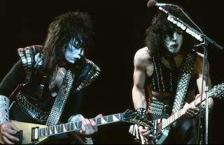 Vinnie Vincent (left) and Paul Stanley perform onstage with Kiss in Los Angeles, California in 1983