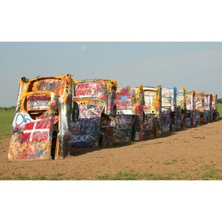 Located on a cattle ranch in the middle of Texas, the Cadillac Ranch is a commemorative art piece first created in 1974. Each Cadillac, made between 1949 and 1963, was planted nose first into the ground to show the evolution of the cars' defining tailfins. Although on private property, the Cadillac Ranch is open to the public. You are also welcome to bring along your spray paint and leave your colorful mark. It won't stay long, because so many people come through to see the Cadillac Ranch each day. This means you will have to make this a traditional stop on your way through Amarillo, Texas. Don t forget to snap a pic with your digital camera so you can see how the artwork changes each time you stop.