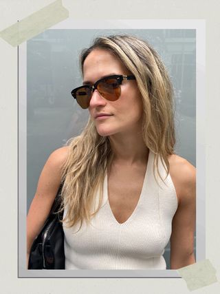 A fashion editor wearing the Miu Miu Runway sunglasses.