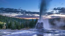 A geyser erupts in Yellowstone National Park. It is supplied with water superheated by magma in underground fluid pathways.