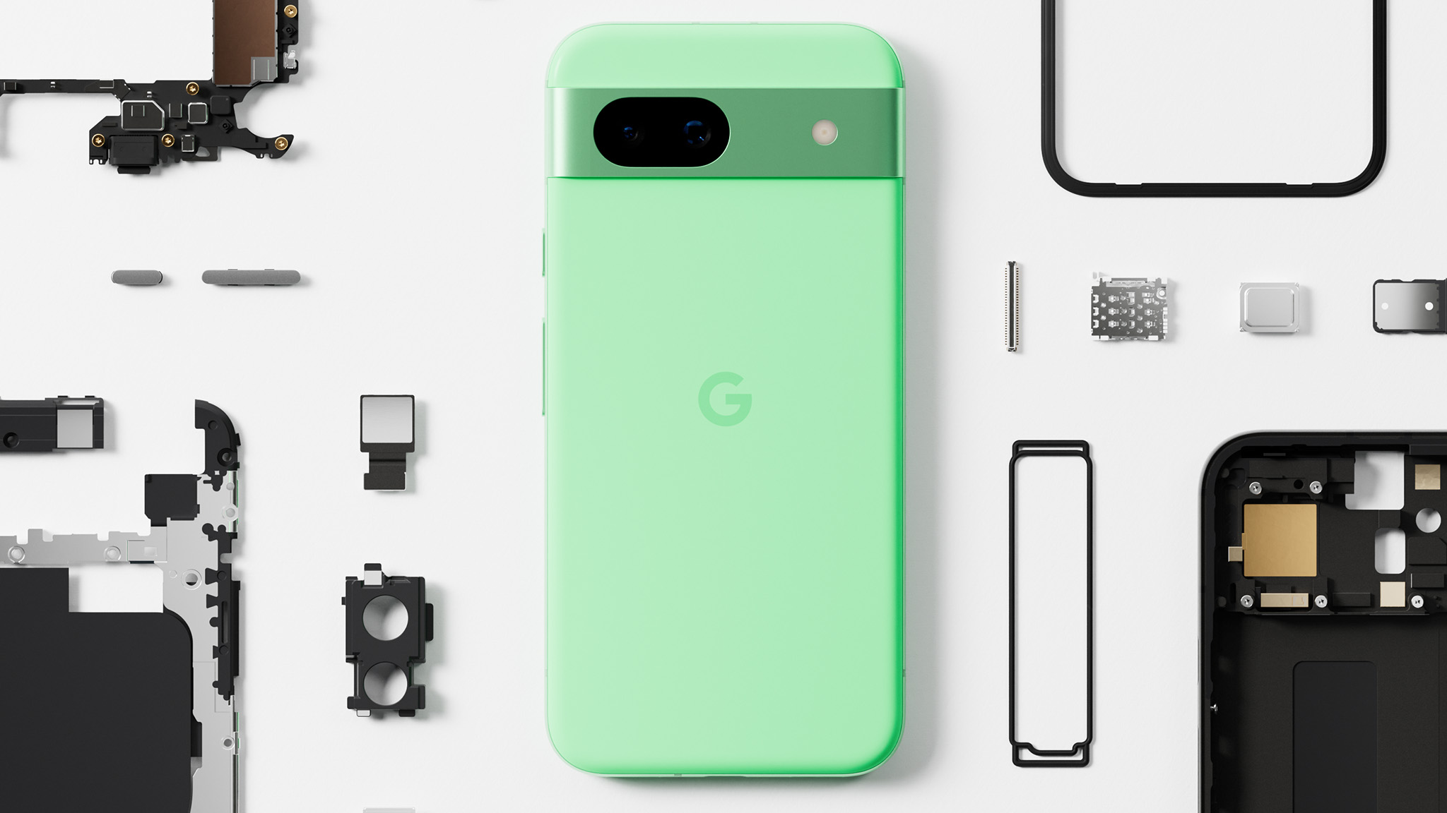 The Aloe Google Pixel 8a next to recycled materials