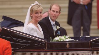 Prince Edward and Duchess Sophie leave in an open carriage following their wedding at St. George's Chapel on June 19, 1999